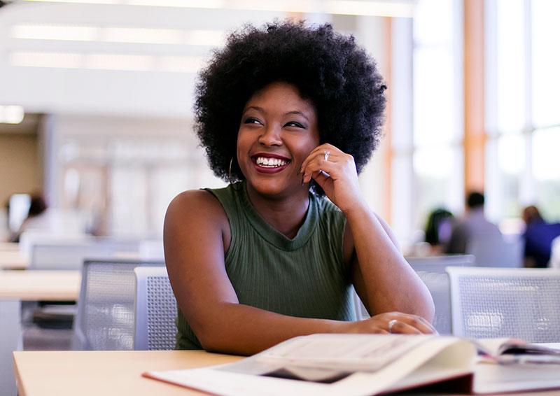 student in library